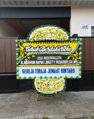 Papan Bunga Duka di Wenang Selatan